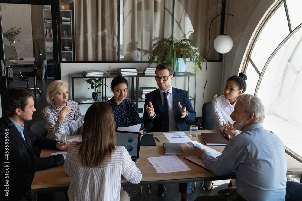 Diverse employees team listening to coworker at corporate meeting in office,  colleagues workers involved in briefing, brainstorming discussing project  strategy, sharing ideas, partners negotiating Stock Photo | Adobe Stock