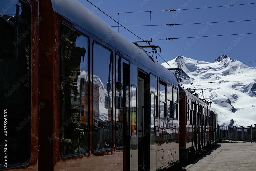 View of the swiss alps Matterhorn and Monte Rosa from Gornergrat station with train mirror reflection View of the swiss alps Matterhorn and Monte Rosa from Gornergrat station with train mirror reflection