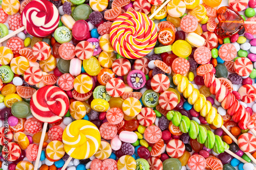 Canvas Print Colorful lollipops and different colored round candy.