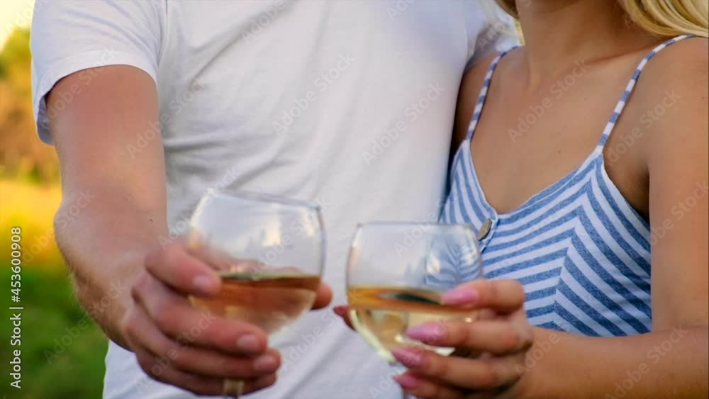 Picnic in nature with wine lovers together. Selective focus. Picnic in nature with wine lovers together. Selective focus.
