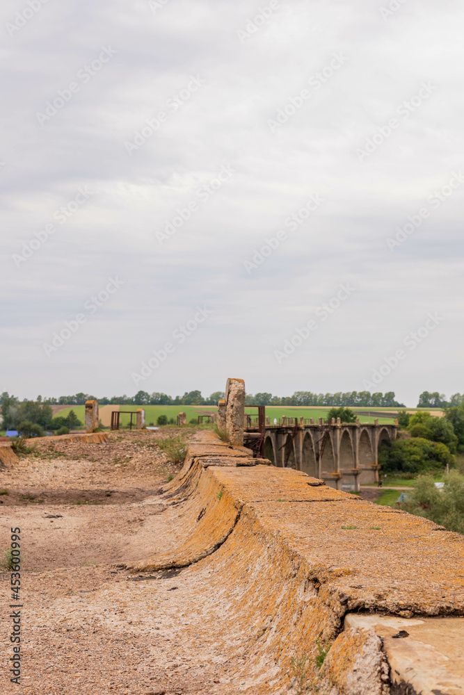 Part of the Mokrinsky railway bridge, top view. Historical reinforced concrete arched viaduct, railway crossing over the Utka river, located in the village of Mokry, Kanashsky district of the Chuvash Part of the Mokrinsky railway bridge, top view. Historical reinforced concrete arched viaduct, railway crossing over the Utka river, located in the village of Mokry, Kanashsky district of the Chuvash