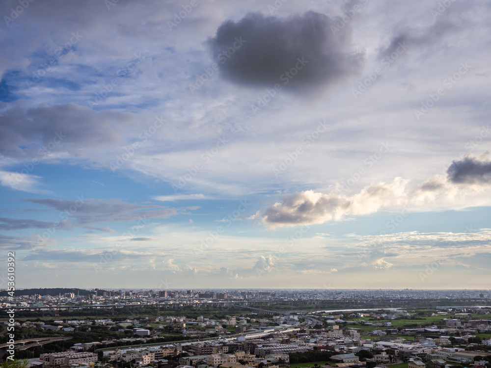 View of city from the beautiful mountain. Blue sky in sunset time.