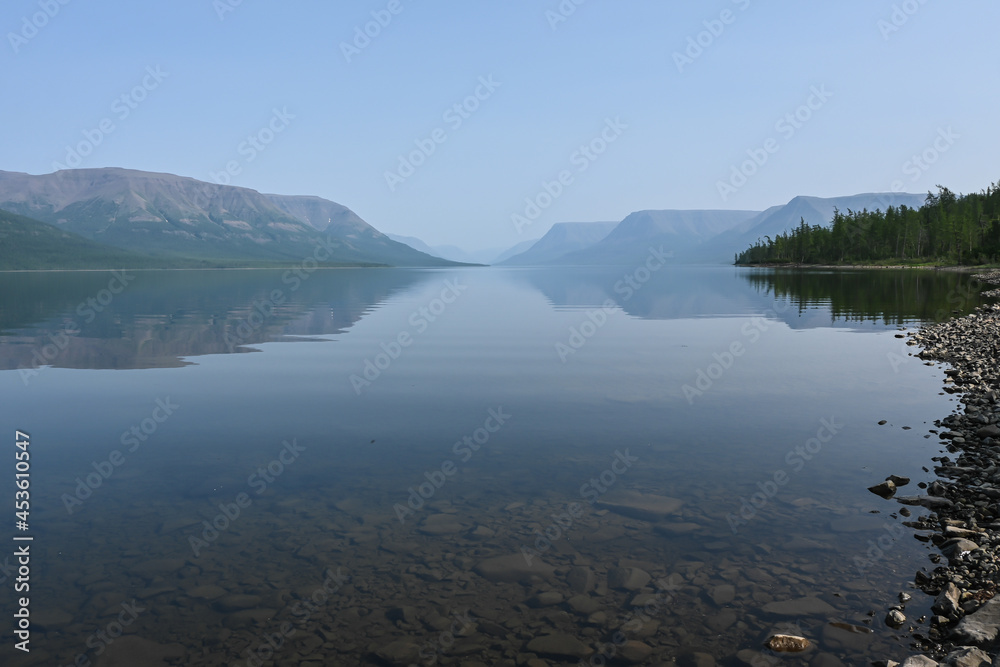 Putorana Plateau. Fog on a mountain lake. Putorana Plateau. Fog on a mountain lake.
