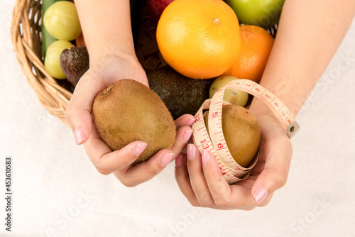 Kiwi and tape for slimming fruit. photo