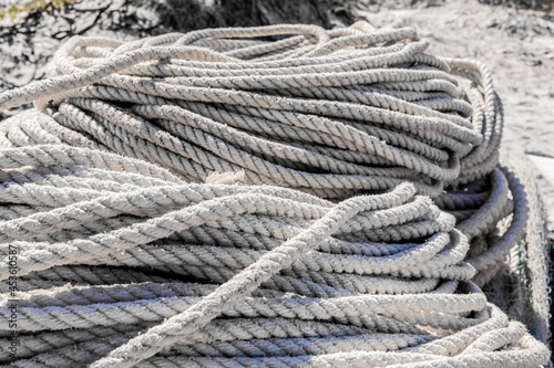 traditional fishing net and rope on small rowing boat