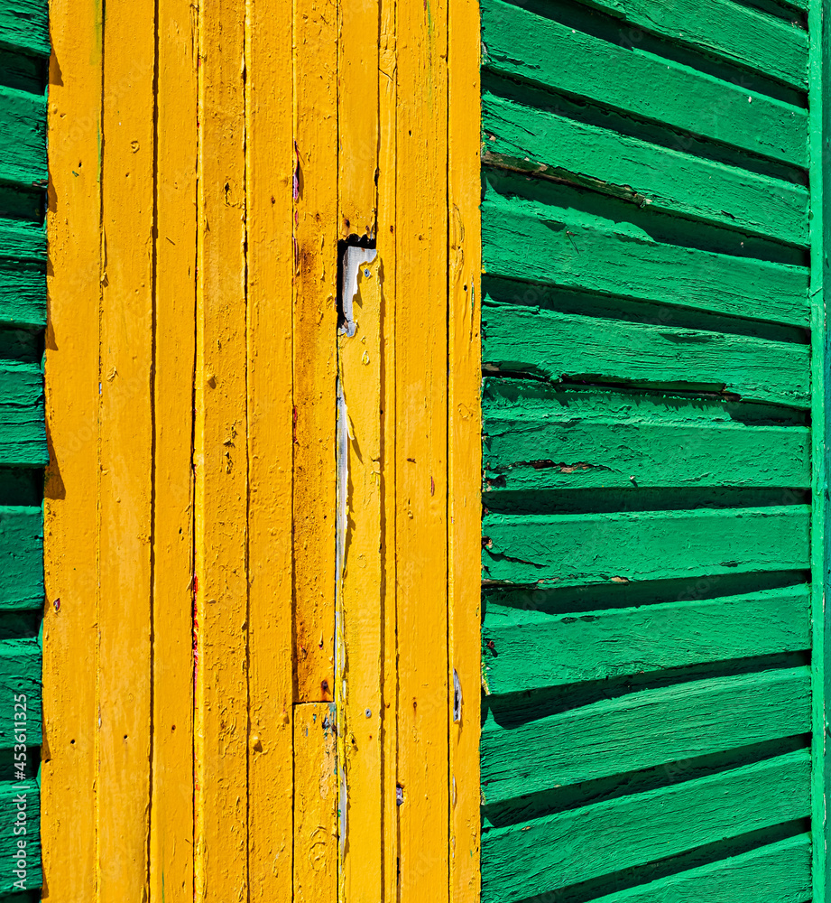 Macro texture of old faded paint on wooden timber planks Macro texture of old faded paint on wooden timber planks
