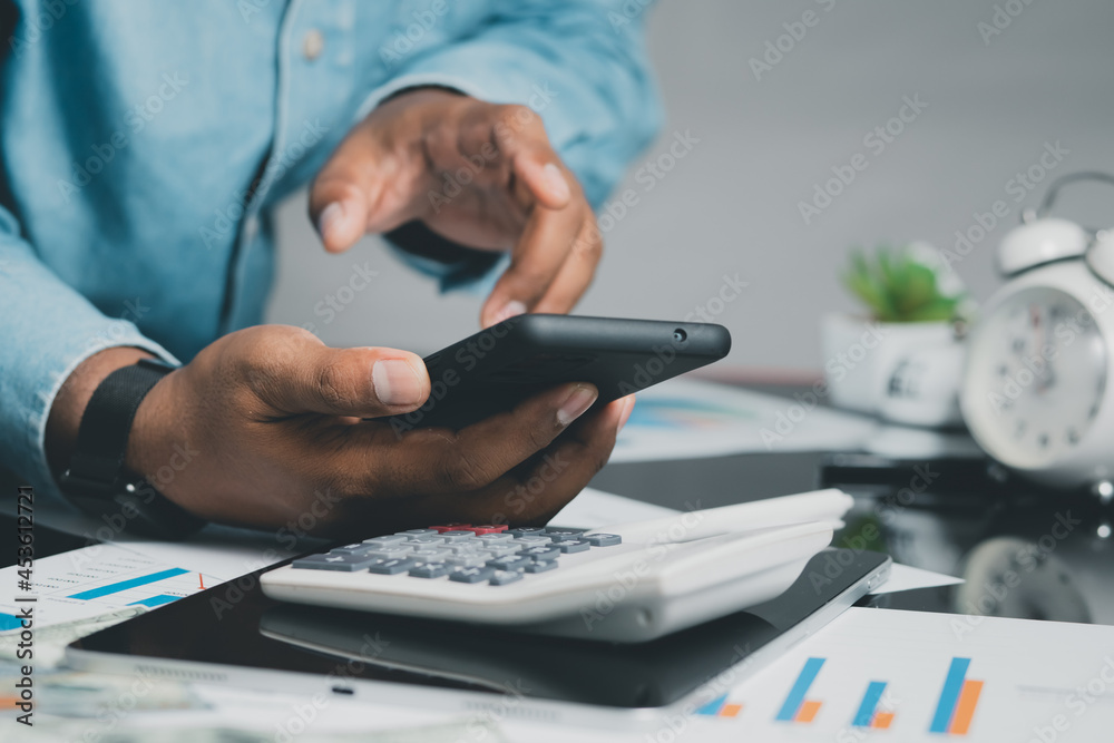 Fototapeta premium concept of mobile technology Businessmen use smartphones while working at home or office.