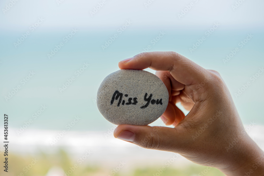 Miss you whiten on hand and on sandy beach. Miss you whiten on hand and on sandy beach.