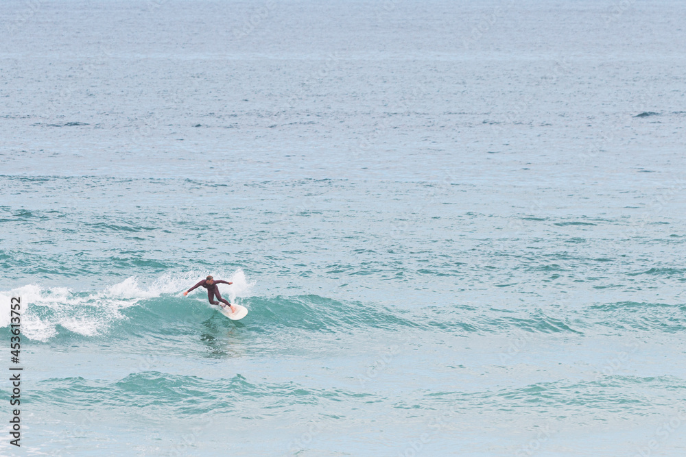 Surfer turning on the wave, les casernes beach, seignosse, landes, france