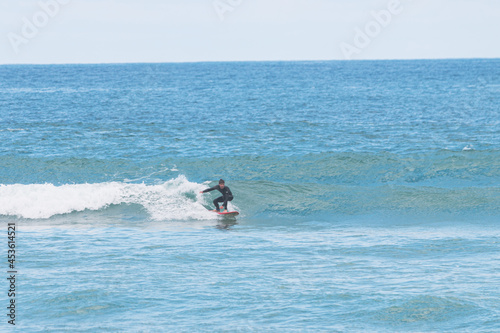Surfing a small left wave, les casernes beach, seignosse, landes, france