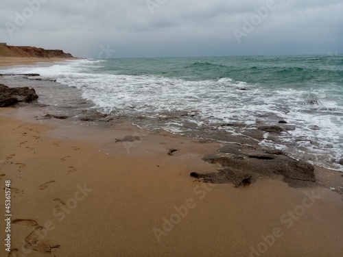 beach and sea on a cloudy summer s day