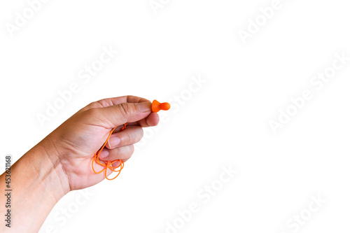 Ear plugs hearing protection in men's hand on white background,safety concept