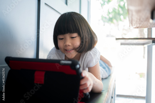 kid watching tablet, child addicted cartoon Free Download kid watching tablet, child addicted cartoon - GFXLoad