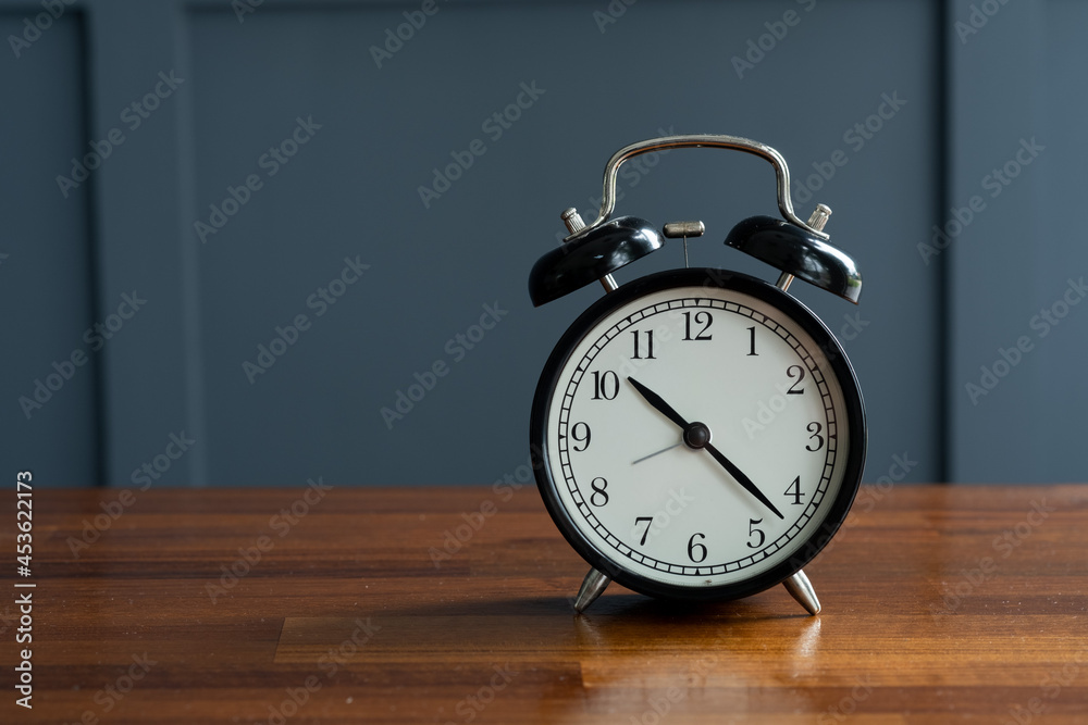 alarm clock on the table with blur background alarm clock on the table with blur background