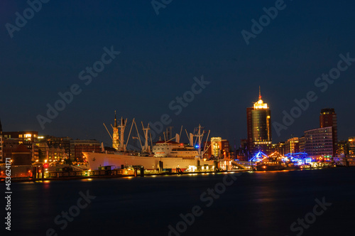 Hamburg skyline long exposure with river Elbe and ship illuminated after sunset   Hamburg  Germany