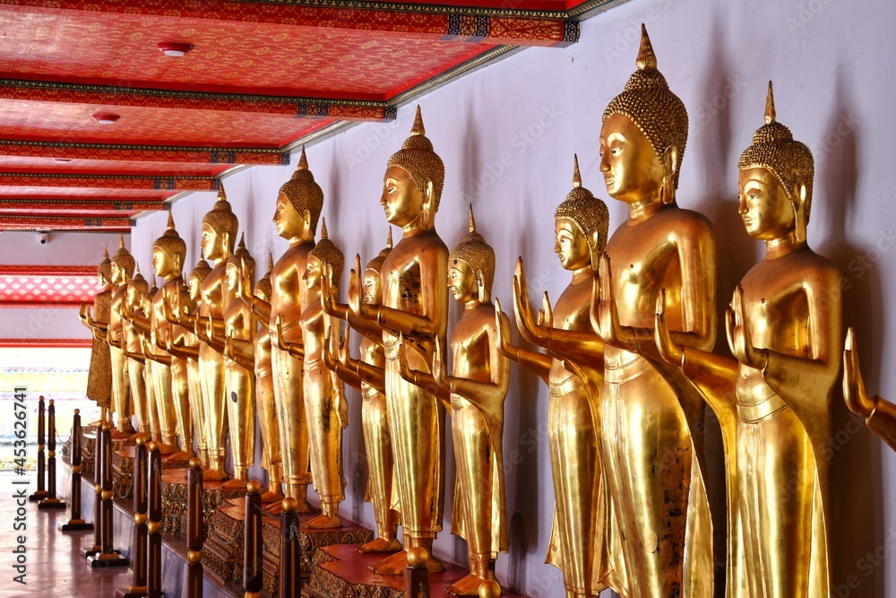 Fototapeta premium The Buddha statue in the standing posture at Wat Pho also spelled Wat Po, is a Buddhist temple in Bangkok, Thailand.