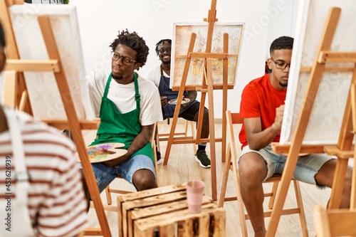 Group of young african american artist man smiling happy drawing at art studio.