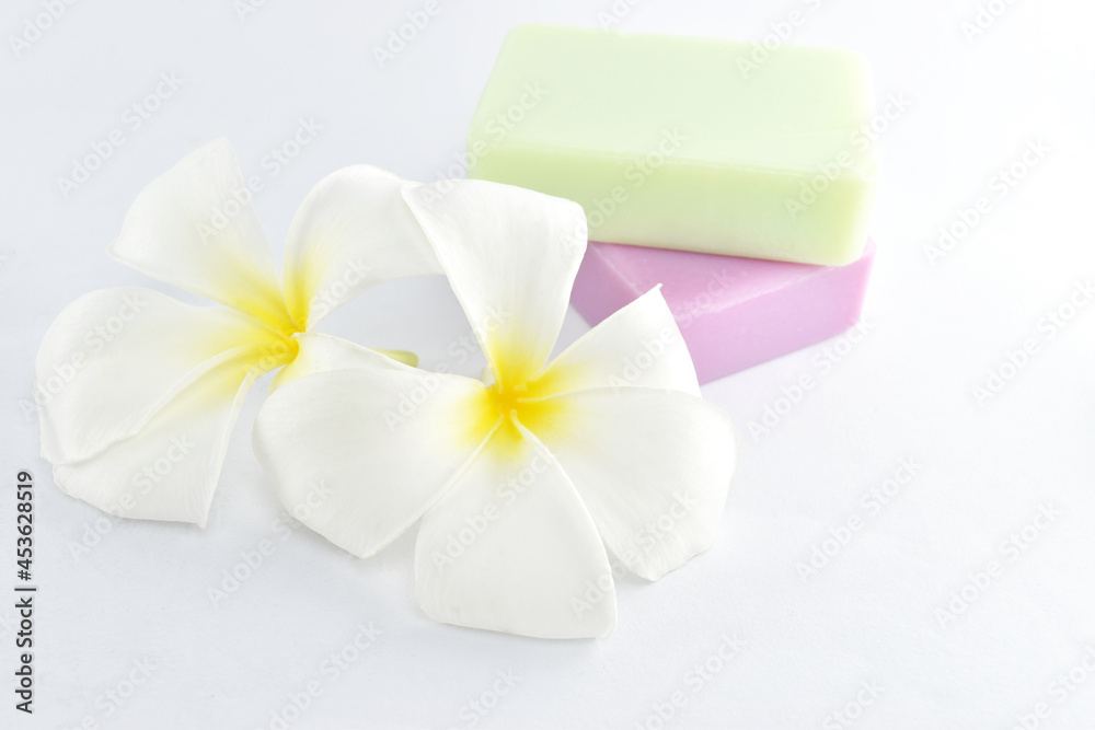 natural soap and plumeria on white background. natural soap and plumeria on white background.
