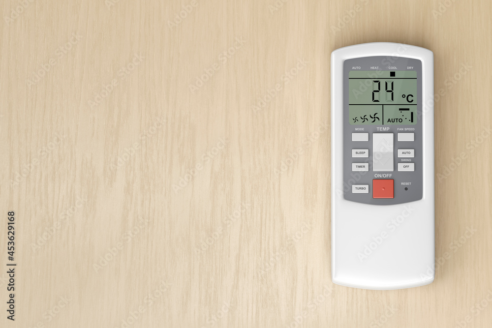 Remote control for air conditioner on wooden table, top view Remote control for air conditioner on wooden table, top view