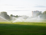 Irrigation system watering a golf course