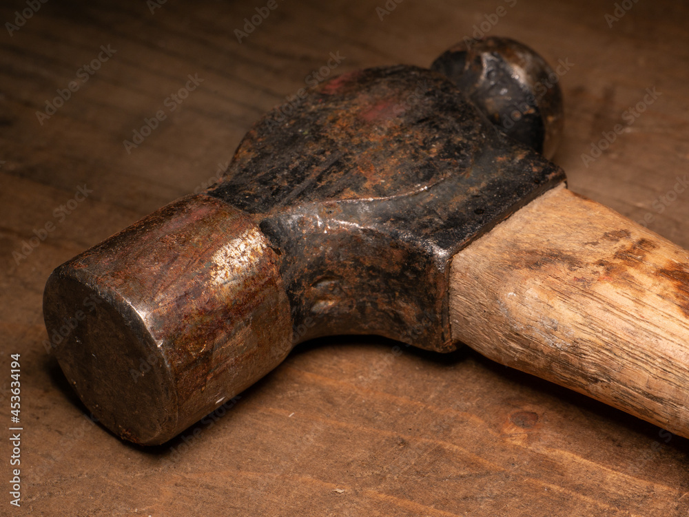 An old rusty ball head hammer