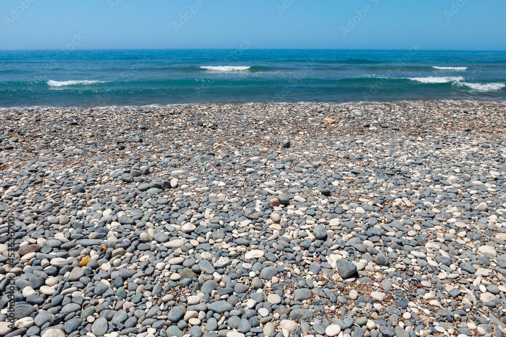 grey and white pebble beach on the mediterranean sea grey and white pebble beach on the mediterranean sea