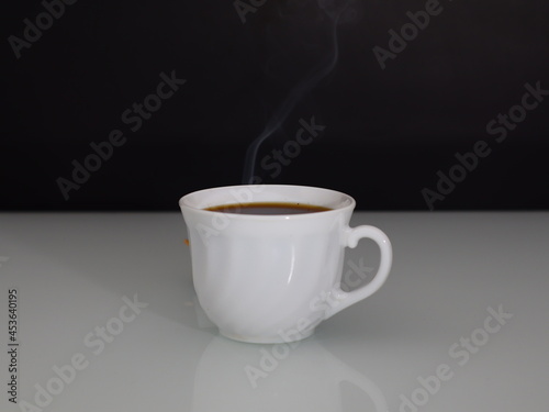 hot coffee steam on a dark background copy space.