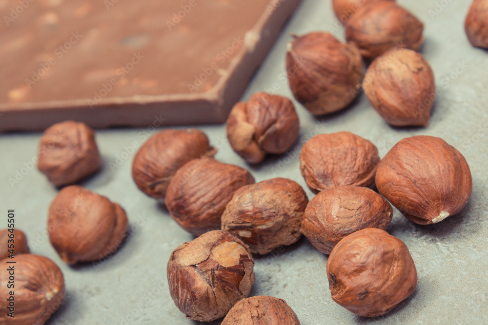 Chocolate with hazelnuts and raisins. Delicious dessert Chocolate with hazelnuts and raisins. Delicious dessert