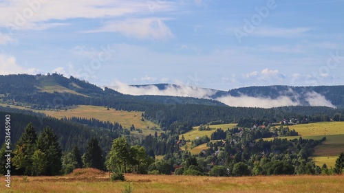 A panoramic view to the Plessberg hill and surrounding landscape with morning fog at Ore Mountains, Czech republic