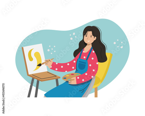 A girl artist paints a picture. Creative professions.