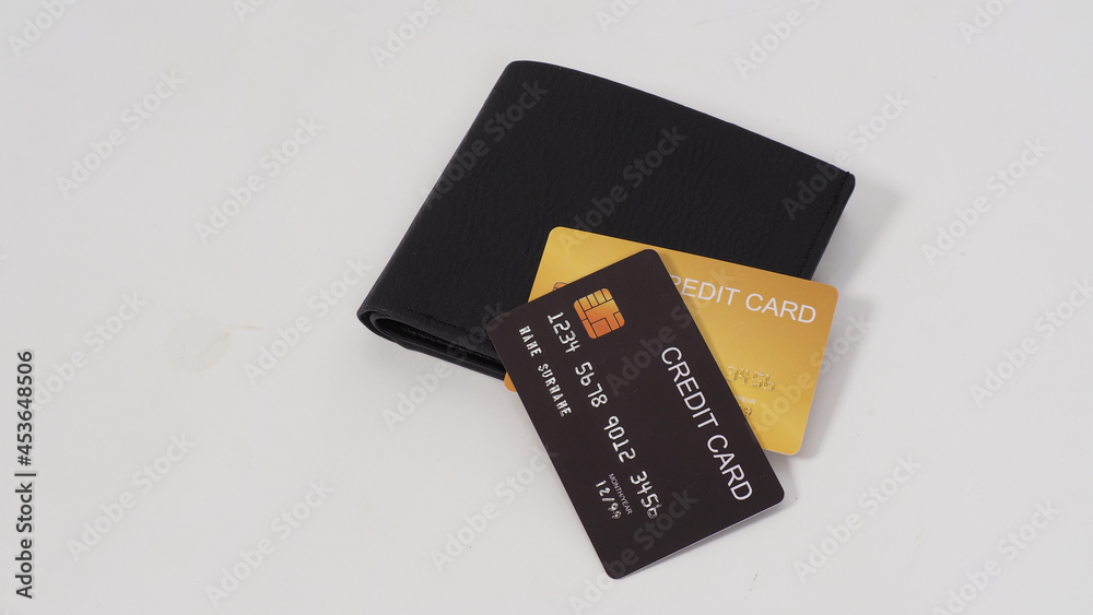 Credit card Black and gold color in black on wallet isolated on white background.. Credit card Black and gold color in black on wallet isolated on white background..