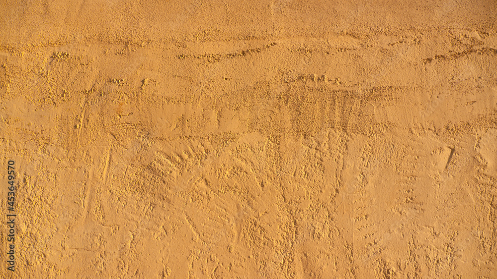 Fototapeta premium Pared de estuco pintado de amarillo