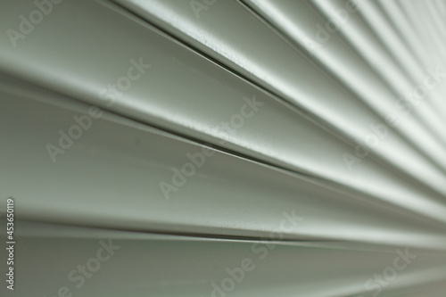 Blinds texture on the street. Plastic surface covering the windows.