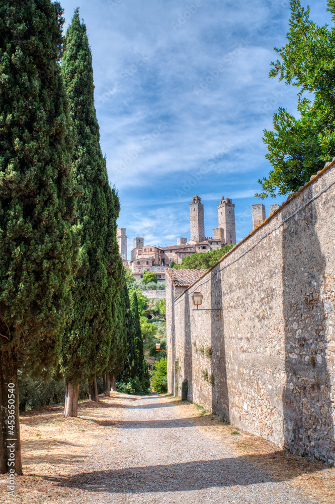 San Gimignano, Italy- July 18, 2021: View of the famous medieval city in Tuscany, famous for its ancient buildings and towers