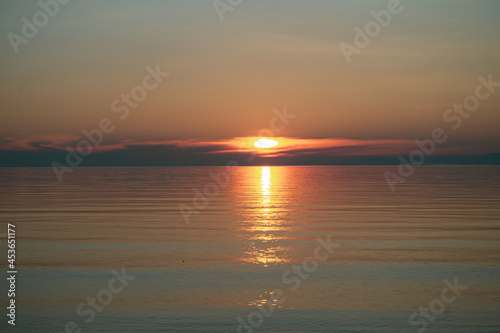 Picturesque view of Lake Baikal in sunrise .Rift lake located in southern Siberia, Russia. The largest freshwater lake by volume in the world. A Natural Wonder Of The World. © Quatrox Production