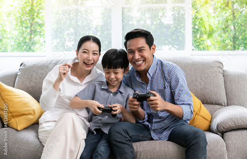 Happy family with sons playing at home and weekend for family