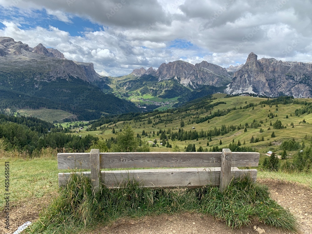 Fototapeta premium Relaxing after hiking and biking by enjoying the view of Pizes de Cir - Cirspitzen Panorama in the Dolomites Mountanis in South Tyrol Italy.