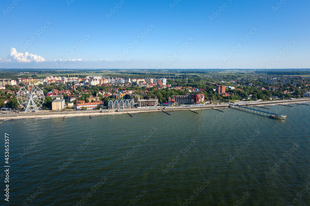 Fototapeta premium Baltic sea coastline with Zelenogradsk embankment for promenade. Kaliningrad region. Aerial panorama