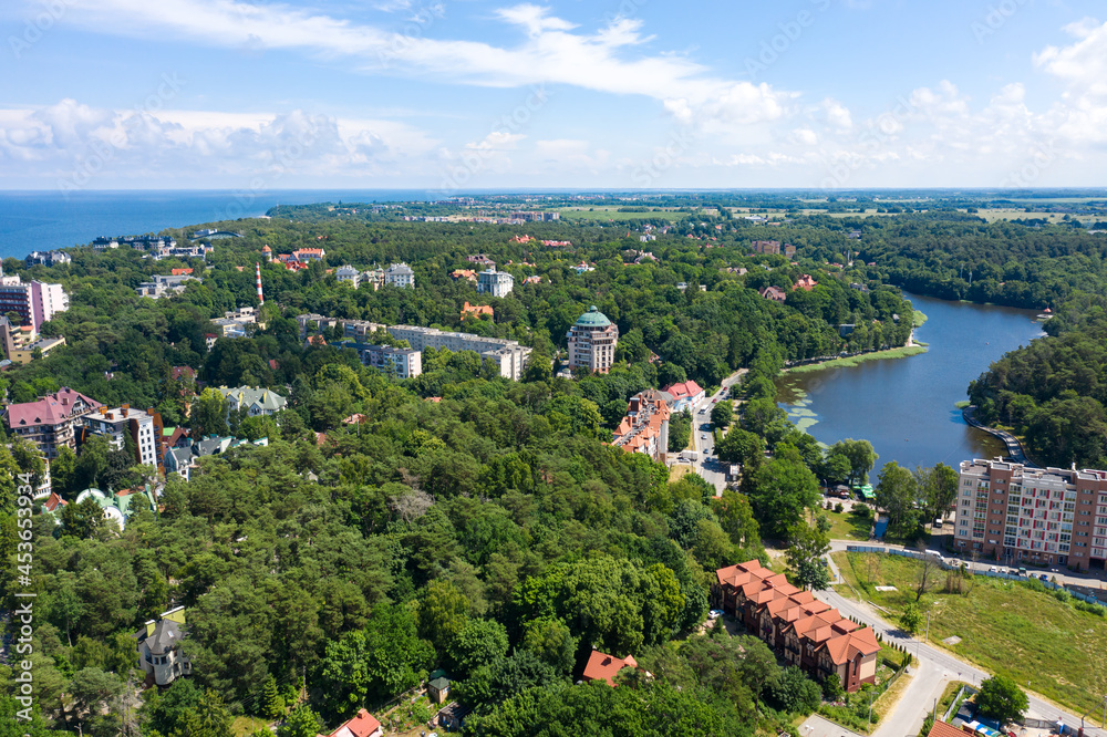 European city with park. Aerial view on Svetlogorsk town and Tikhoe lake