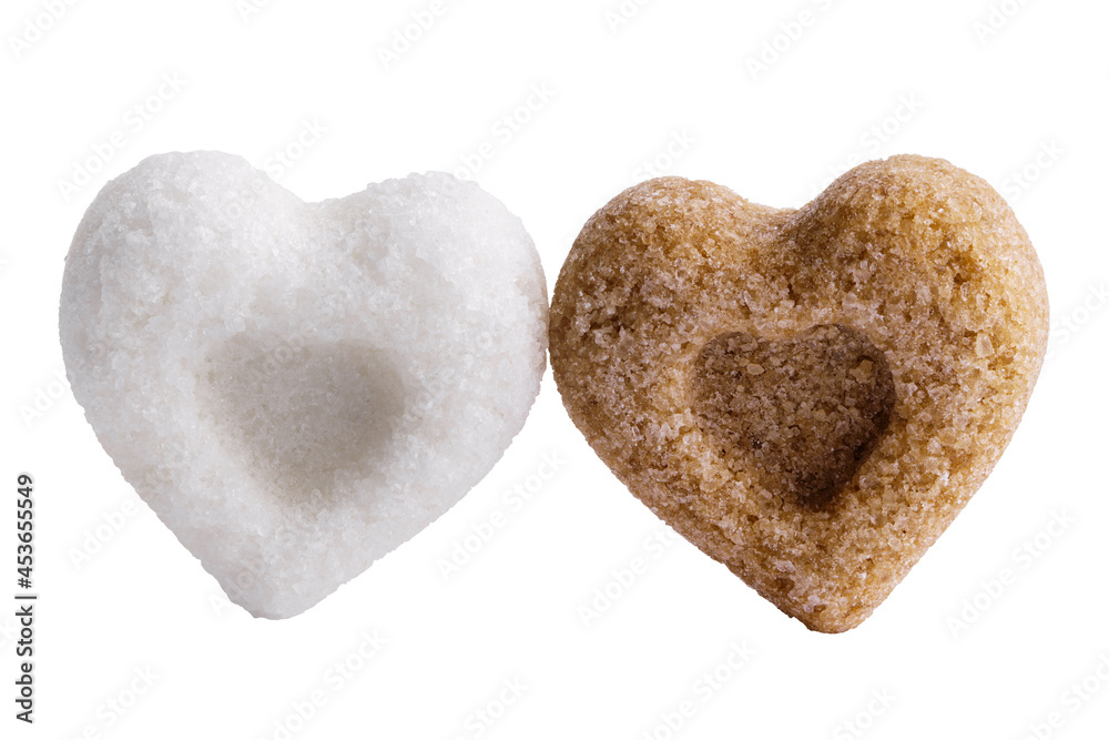 Obraz premium Heart-shaped sugar isolated on white. Interracial relationship metaphor