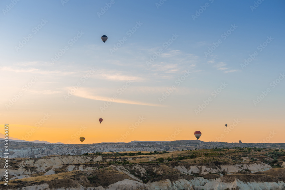 Low number of balloons due to quarantine. The great tourist attraction of Cappadocia - balloon flight. Entertainment, tourism an vacation. Travel tour. Goreme, Cappadocia, Turkey. Low number of balloons due to quarantine. The great tourist attraction of Cappadocia - balloon flight. Entertainment, tourism an vacation. Travel tour. Goreme, Cappadocia, Turkey.
