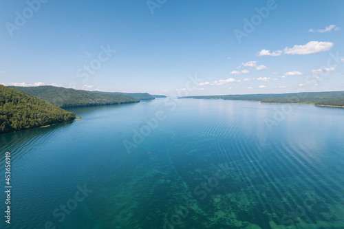 The Angara River is a major river in Siberia leaving Lake Baikal near the settlement of Listvyanka. Panoramic aerial view. © Quatrox Production