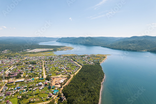 The Angara River is a major river in Siberia leaving Lake Baikal near the settlement of Listvyanka. Panoramic aerial view.