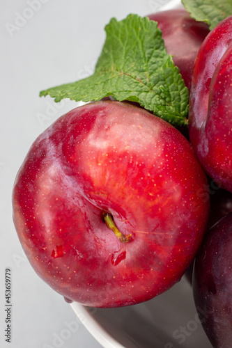 Plums on  and white background