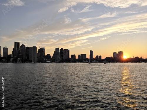 Colorful sunset over Boston skyline from the sea © Ben