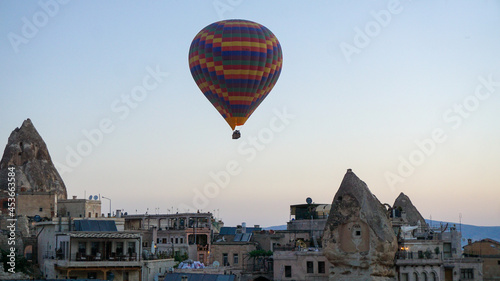 Hot air balloons launch in the Goreme national park in Cappadocia, Turkey. Colorful balon flying over. Cappadocia's greatest tourist attraction is ballooning. 