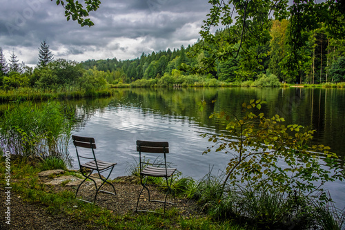 Two chairs at the shore of the lake © Lena
