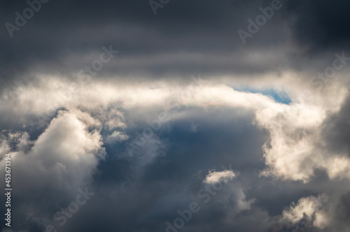 Dramatic cloudy sky background. Dark blue stormy cloudy sky. Natural photo background © Dmitrii Potashkin