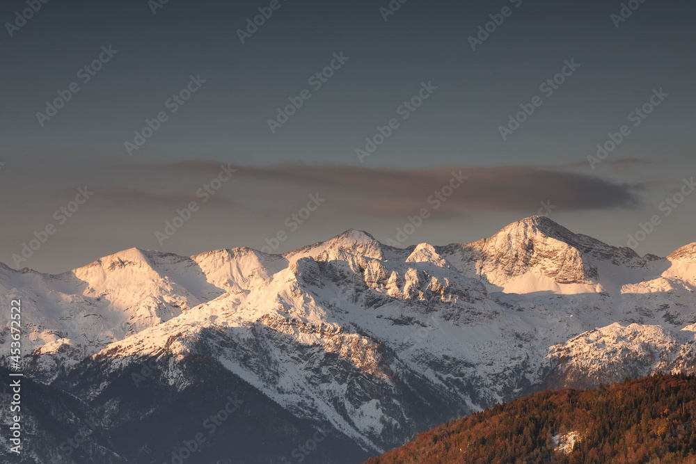 mountain peaks in winter at sunrise