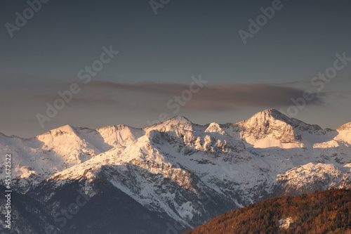 mountain peaks in winter at sunrise